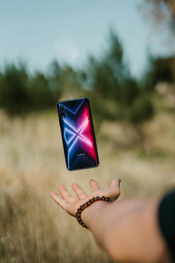 person holding black android smartphone